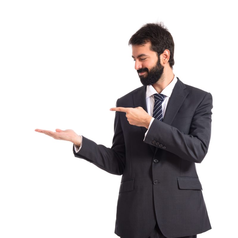 Businessman presenting something over isolated white background
